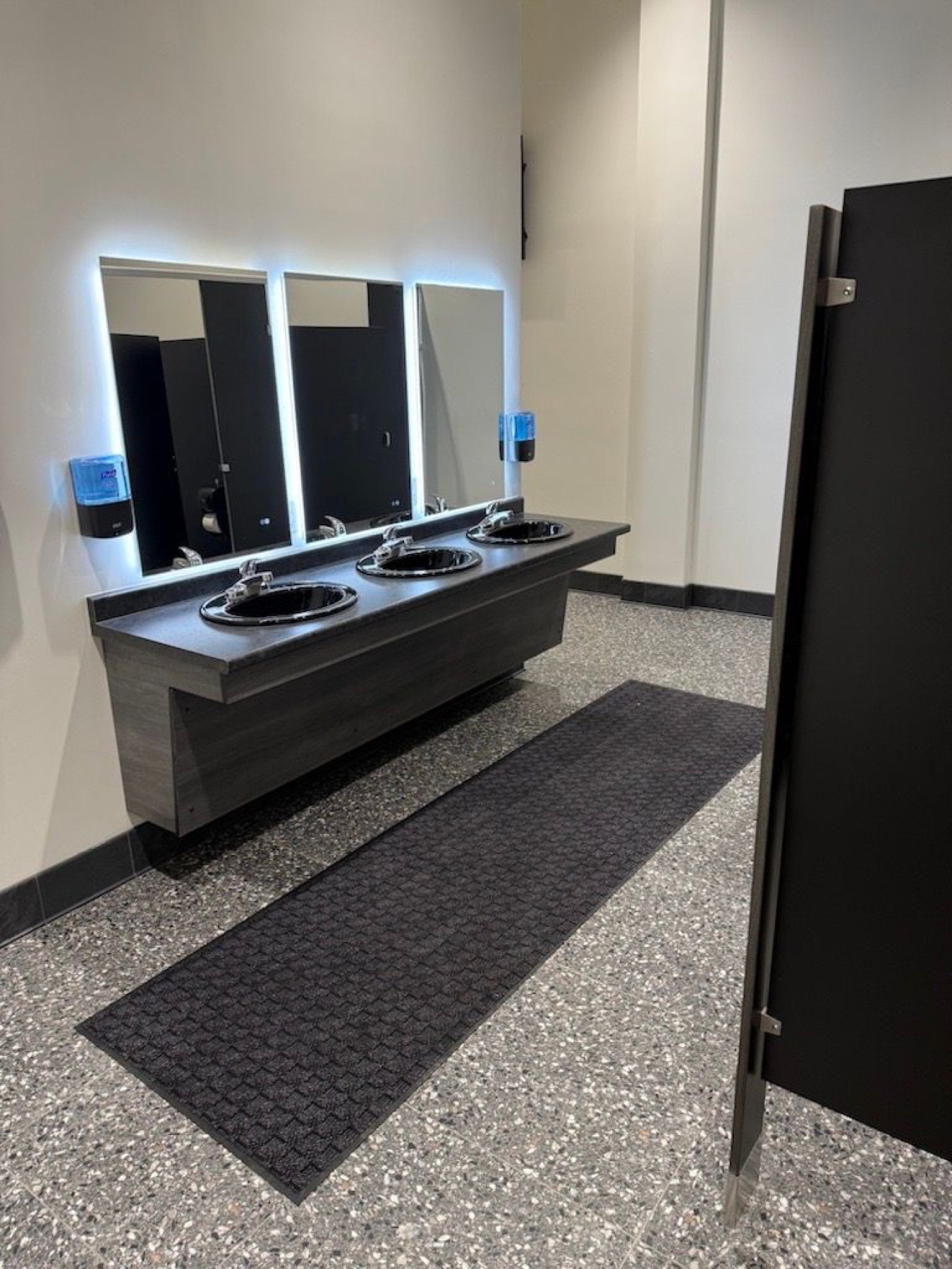 Mirrors, sinks, and counter inside the Downtown changing room