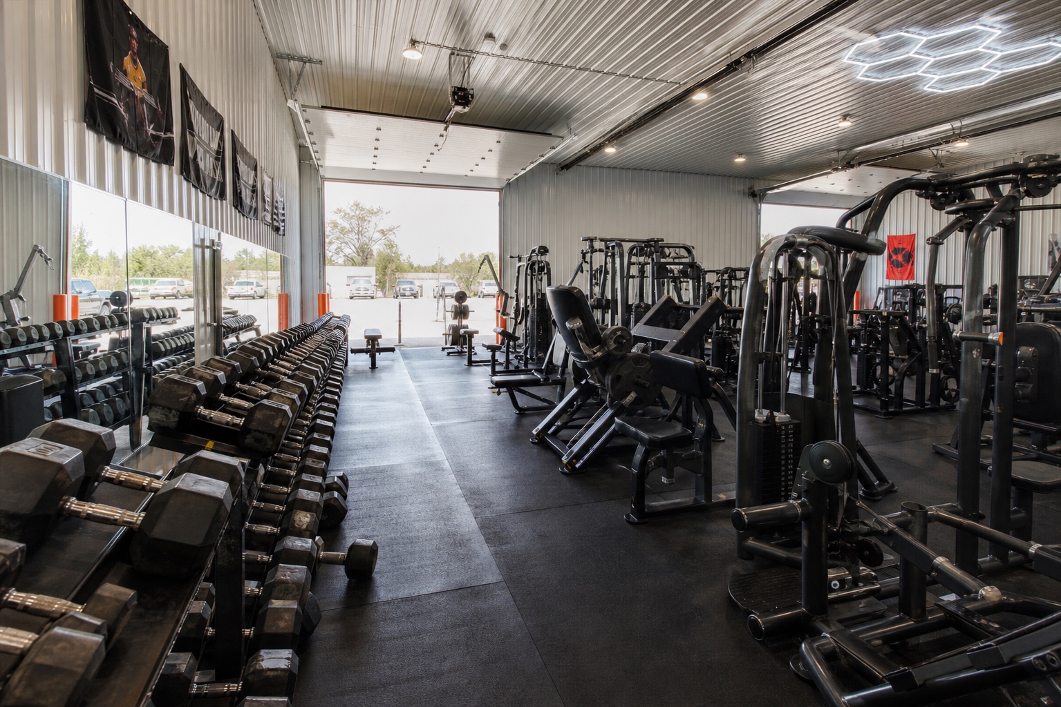 Wide equipment aisle inside House of Iron Westside