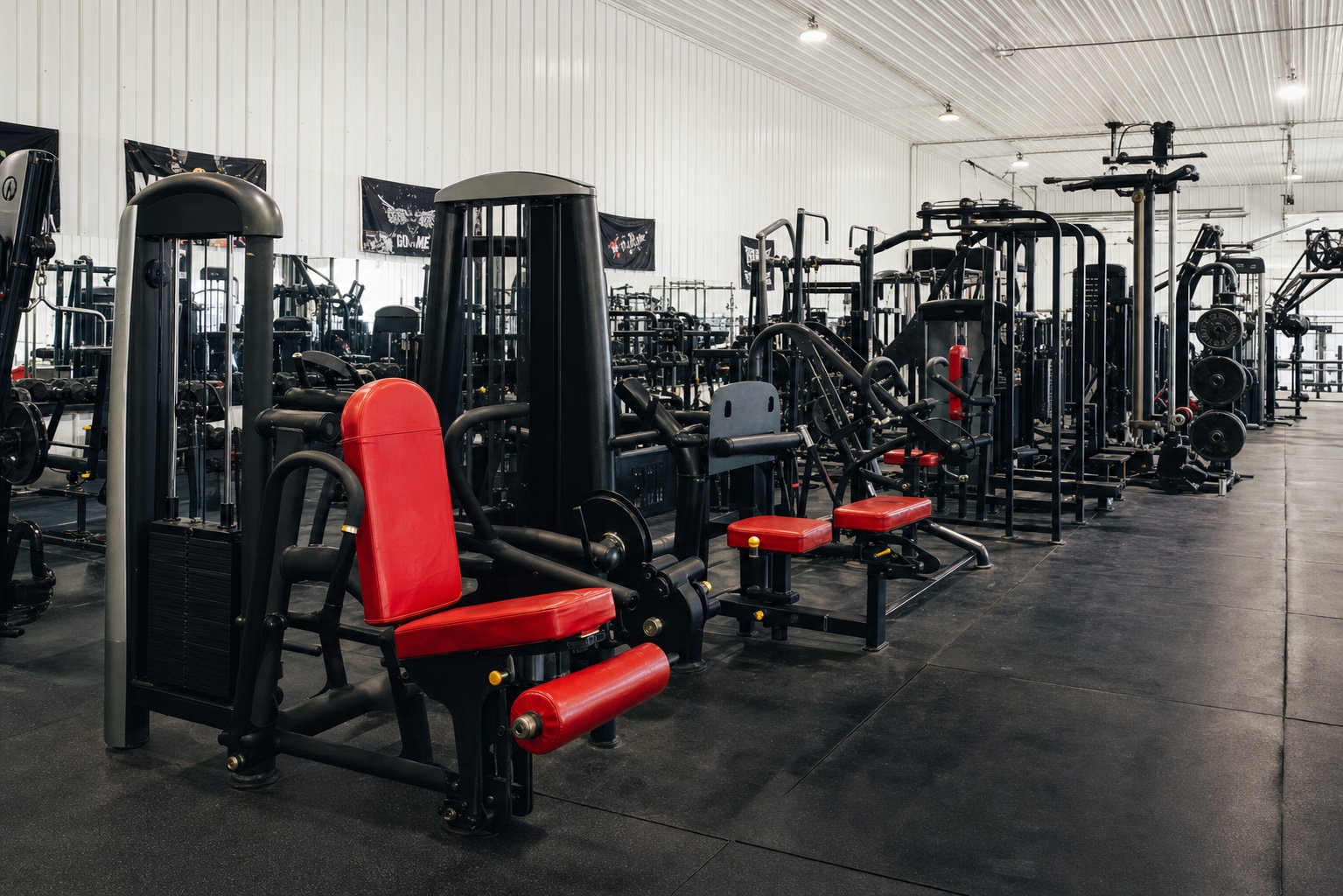 Red-upholstered strength machines on the Westside floor